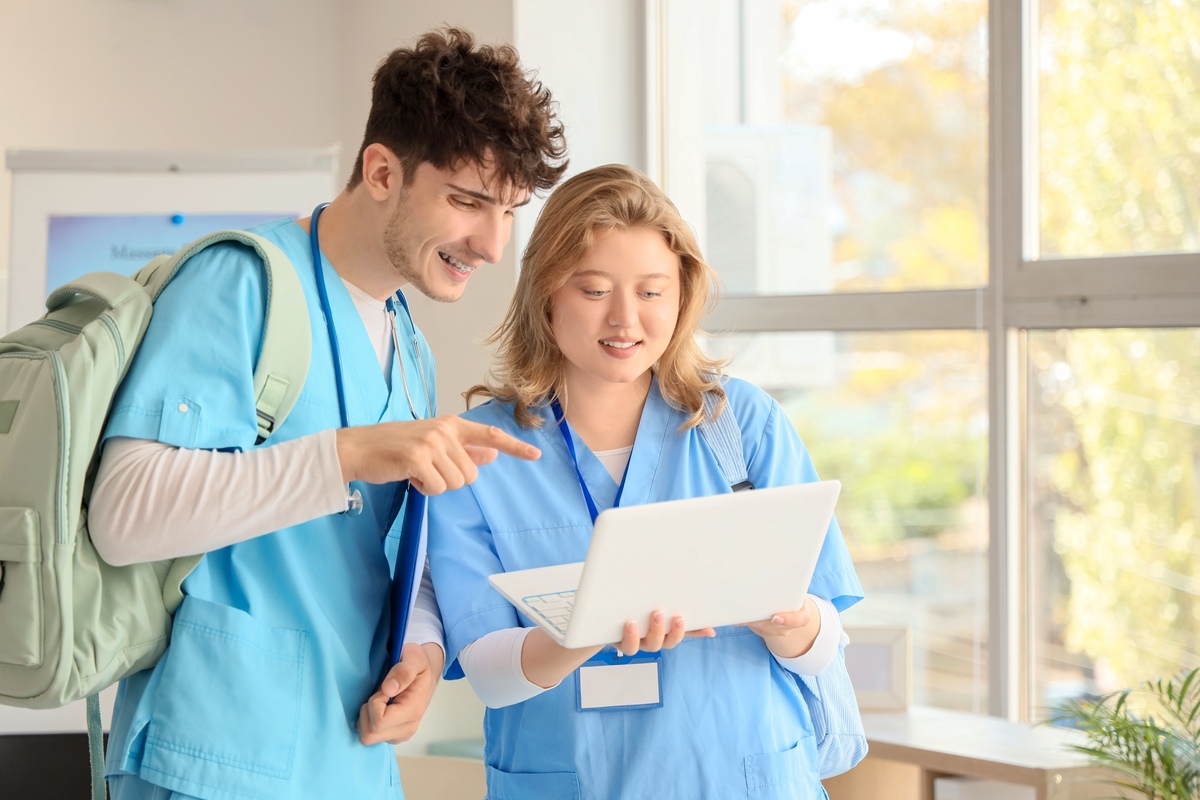 Students enrolled in a medical assistant program in NYC reviewing coursework during healthcare training